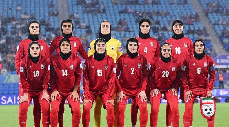 FILE - Iran players pose for a team photo ahead of the Women's Asian Cup soccer match between Iran and the Philippines in Robina, Australia, Sunday, March 8, 2026. (Dave Hunt/AAPImage via AP,File)