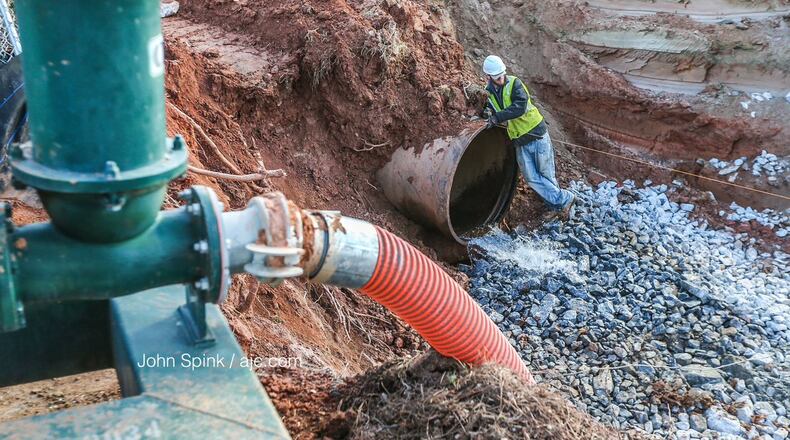 DeKalb County Watershed Management officials expect to complete repairs to a broken water main Friday evening, officials said. JOHN SPINK / JSPINK@AJC.COM