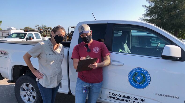 Officials with the Texas Commission on Environmental Quality conduct water sampling in Lake Jackson, Texas, after brain-eating amoeba contaminated the supply.