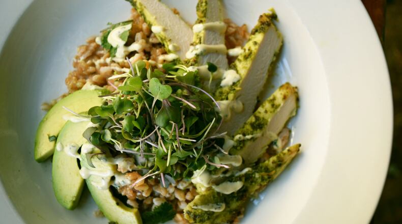 Ryan Burke’s Green Grain Bowl includes farro, pesto-coated chicken, avocado slices, Green Garlic Aioli and a garnish of kale microgreens. CONTRIBUTED BY TORI ALLEN PR