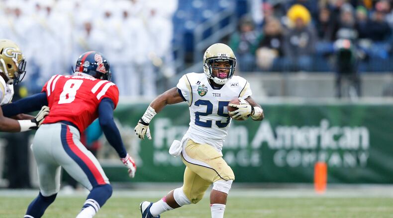 Robert Godhigh #25 of the Georgia Tech Yellow Jackets runs with the ball in the first half against the Ole Miss Rebels during the Franklin American Mortgage Music City Bowl at LP Field on December 30, 2013 in Nashville, Tennessee.