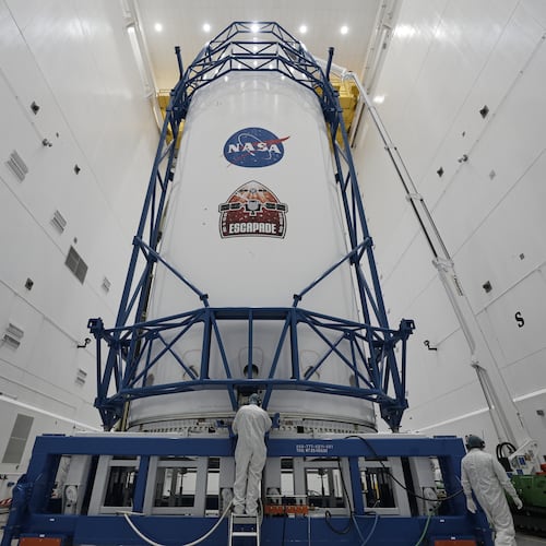 In this image provided by Blue Origin, NASA's identical Mars orbiters, named Escapade (Escape and Plasma Acceleration and Dynamics Explorers), are secured in Blue Origin’s New Glenn rocket's 7-meter fairing, Oct. 31, 2025, in Cape Canaveral, Fla, (Stephanie Plucinsky/Blue Origin via AP)