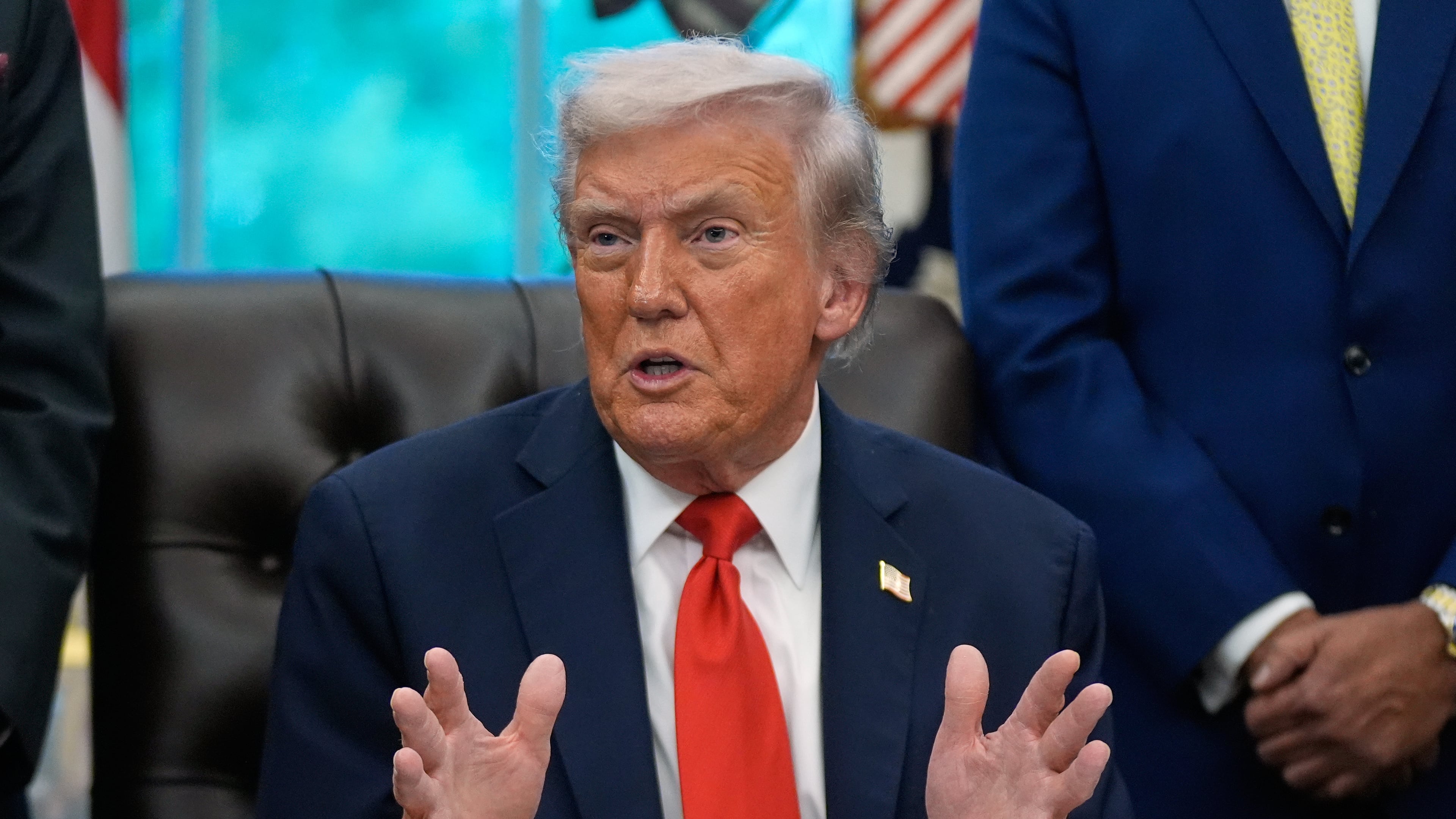 President Donald Trump answers questions from reporters during a Diwali celebration in the Oval Office at the White House, Tuesday, Oct. 21, 2025, in Washington. (AP Photo/Manuel Balce Ceneta)