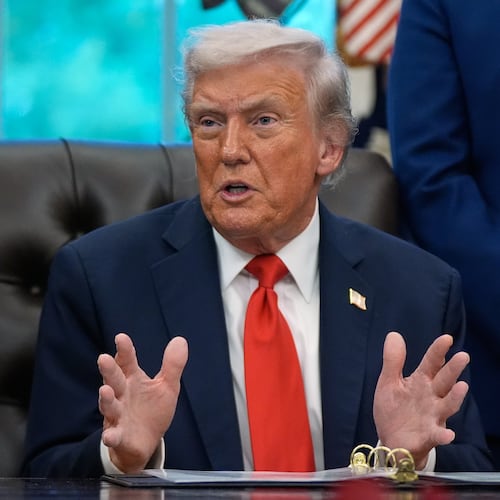President Donald Trump answers questions from reporters during a Diwali celebration in the Oval Office at the White House, Tuesday, Oct. 21, 2025, in Washington. (AP Photo/Manuel Balce Ceneta)