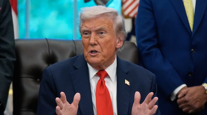 President Donald Trump answers questions from reporters during a Diwali celebration in the Oval Office at the White House, Tuesday, Oct. 21, 2025, in Washington. (AP Photo/Manuel Balce Ceneta)