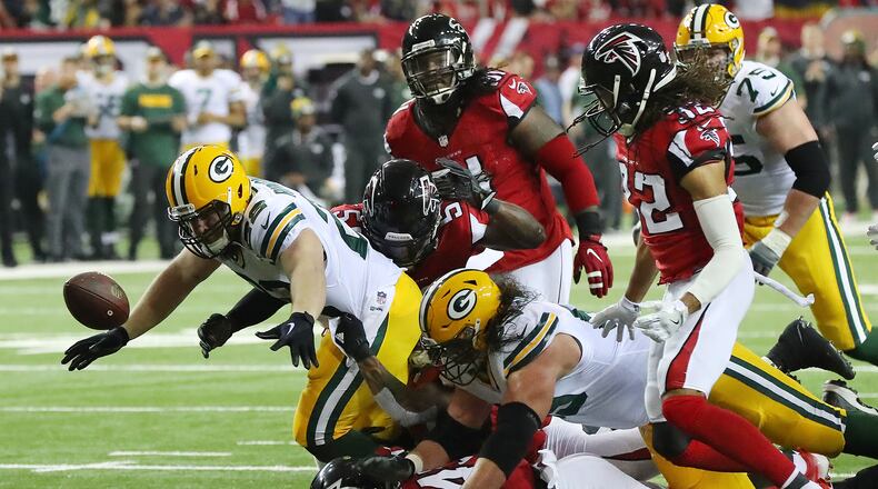 Falcons defenders swarm Packers fullback Aaron Ripkowski forcing a fumble recovered by Jalen Collins during the second quarter in the NFL football NFC Championship game on Sunday, Jan. 22, 2017, in Atlanta. Curtis Compton/ccompton@ajc.com