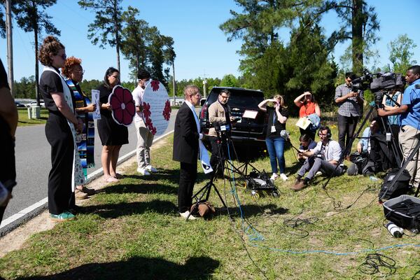Supporters speak outside the Central Louisiana ICE Processing Center in Jena, La., after an immigration hearing for Mahmoud Khalil, the Columbia University activist facing deportation for his role in pro-Palestinian campus protests, Friday, April 11, 2025. (AP Photo/Gerald Herbert)