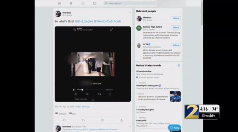 The video shows a student leading another student behind a gate at the school, emulating border control.