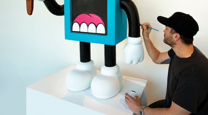 Artist Greg Mike's iconic creation Larry Loudmouf, rendered here as a sculpture, can be seen on walls throughout the city. Courtesy of Greg Mike