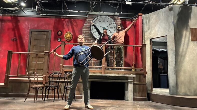 Adam Archer (lower level), Christina Cusack-Curbelo (from left on platform) and Josh Quinn rehearse for "Too Fast, Too Festivus," a Dad's Garage and Horizon Theatre Company coproduction. (Courtesy of Dad's Garage)