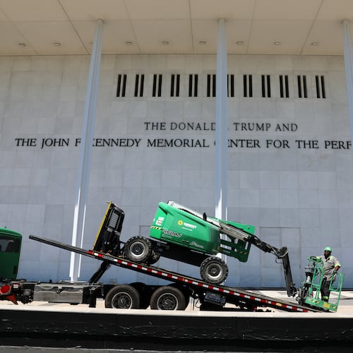 A worker loads equipment on a flatbed truck outside The John F. Kennedy Center for the Performing Arts, Thursday, June 4, 2026, in Washington. (AP Photo/Rahmat Gul)