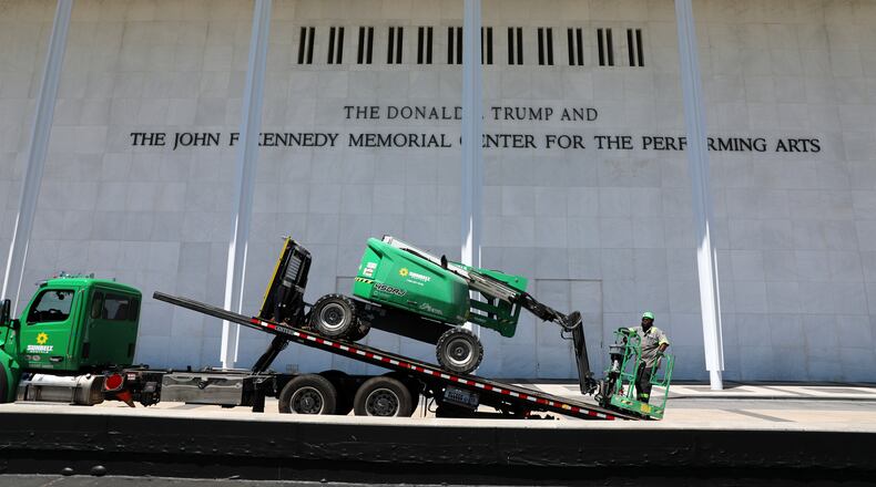 A worker loads equipment on a flatbed truck outside The John F. Kennedy Center for the Performing Arts, Thursday, June 4, 2026, in Washington. (AP Photo/Rahmat Gul)