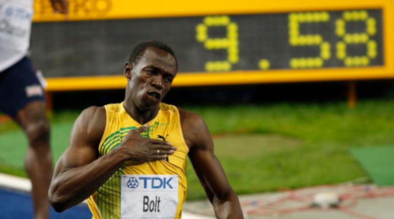 Jamaica's Usain Bolt celebrates setting a new men's 100m world record at the World Athletics Championships in Berlin on Aug. 16, 2009. (AP Photo/Michael Sohn, File)