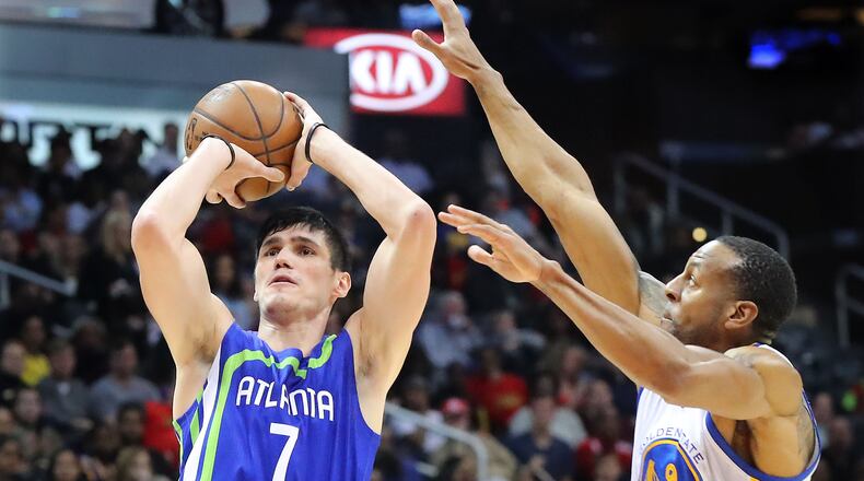 Atlanta Hawks’ Ersan Ilyasova shoots for two against Golden State Warriors Andre Iguodala during the second period in a NBA basketball game on Monday, March 6, 2017, in Atlanta. Curtis Compton/ccompton@ajc.com