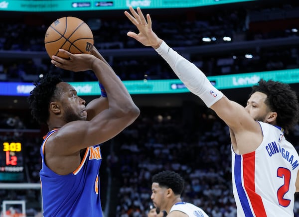 New York Knicks forward OG Anunoby, left, looks to shoot against Detroit Pistons guard Cade Cunningham (2) during the first half of Game 6 of an NBA basketball first-round playoff series Thursday, May 1, 2025, in Detroit. (AP Photo/Duane Burleson)