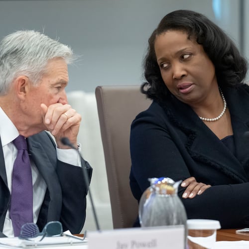 Federal Reserve Chairman Jerome Powell (left) talks with Board of Governors member Lisa Cook during an open meeting of the Board of Governors at the Federal Reserve, June 25, 2025, in Washington. (Mark Schiefelbein/AP)