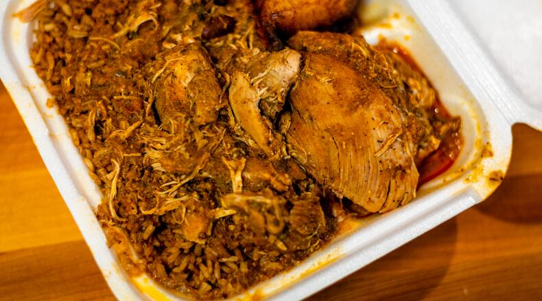 The Caribbean chicken and shrimp from Caribbean Fiesta may not look glamorous, but the tropical flavors sing. Henri Hollis for The Atlanta Journal-Constitution.
