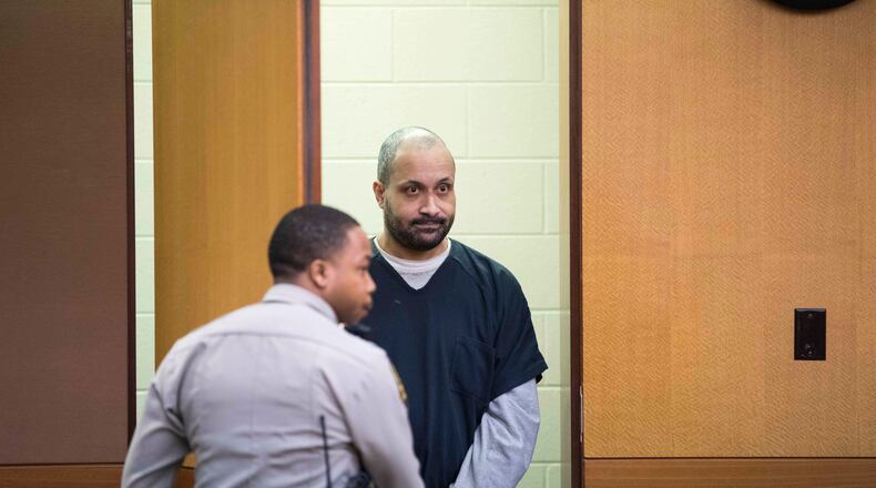 Christopher Clemons enters the courtroom of Thomas A. Cox, Jr. for a plea deal at Fulton County Superior Court, Tuesday, January 23, 2018. Christopher Clemons, 39, who founded Latin Academy Charter School, entered a plea in two criminal cases against him. ALYSSA POINTER/ALYSSA.POINTER@AJC.COM