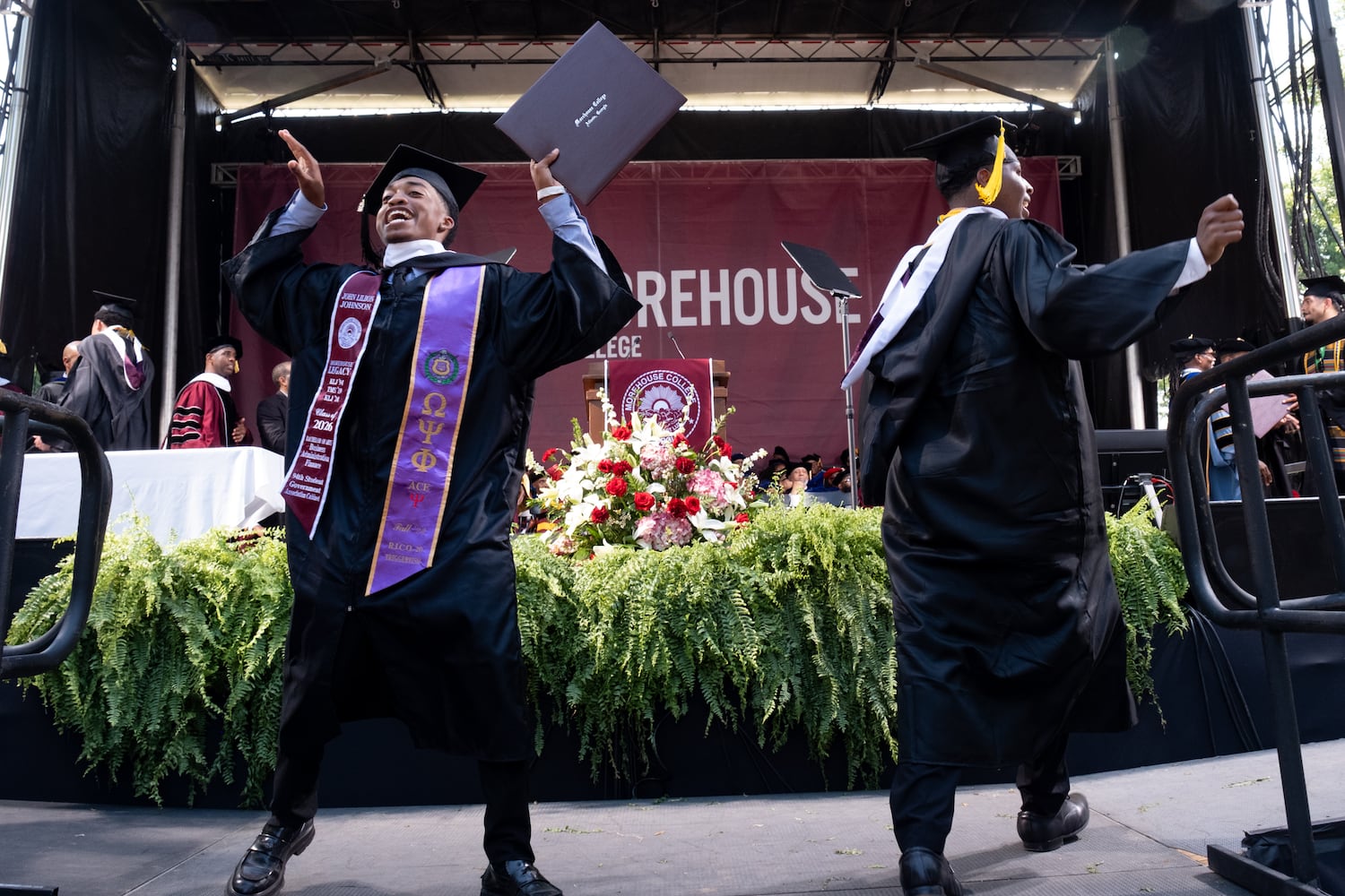 A student celebrates after receiving his diploma during the Morehouse College graduation Sunday, May 17, 2026. (Ben Gray for the AJC)
