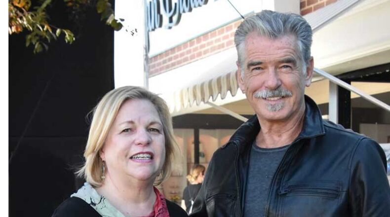 Tucker City Manager Tami Hanlin met former James Bond actor Pierce Brosnan on the set of his new film "The Out-Laws" that was filmed in Tucker. (Courtesy of city of Tucker)