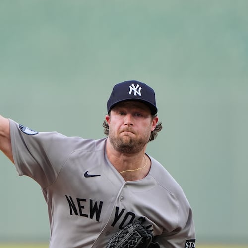 New York Yankees starting pitcher Gerrit Cole throws during the first inning of baseball game against the Kansas City Royals, Wednesday, May 27, 2026, in Kansas City, Mo. (AP Photo/Charlie Riedel)