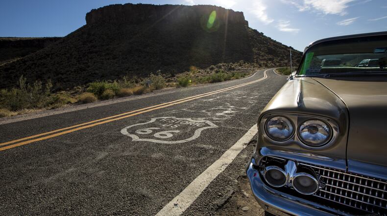 The Black Mountains provide a backdrop for a vintage Chevrolet is parked in front of the1920s Cool Springs Service Station, now a souvenir shop on Historic Route 66 in Cool Springs, Ariz., on May 7, 2017. (Brian van der Brug/Los Angeles Times/TNS)