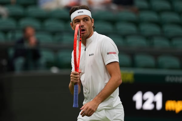 Taylor Fritz of the U.S. reacts during his men's singles fourth round match against Jordan Thompson of Australia at the Wimbledon Tennis Championships in London, Sunday, July 6, 2025.(AP Photo/Joanna Chan)