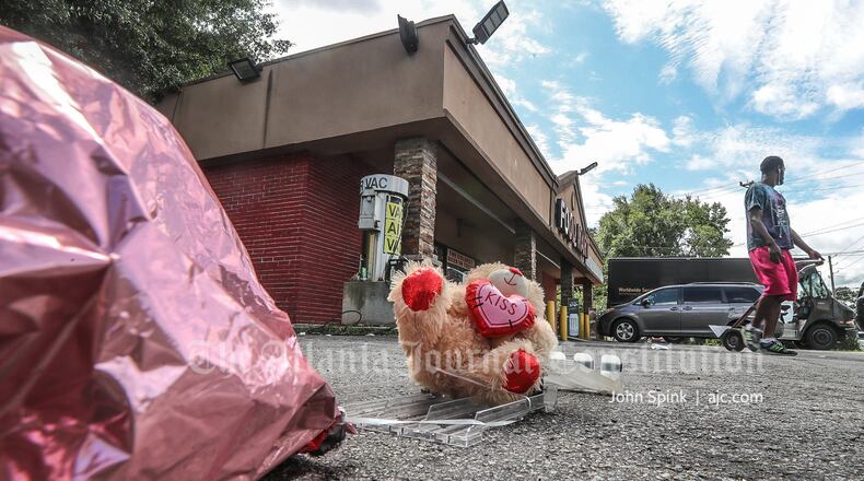 A small memorial was seen outside a DeKalb County food mart Thursday after a 19-year-old was killed.
