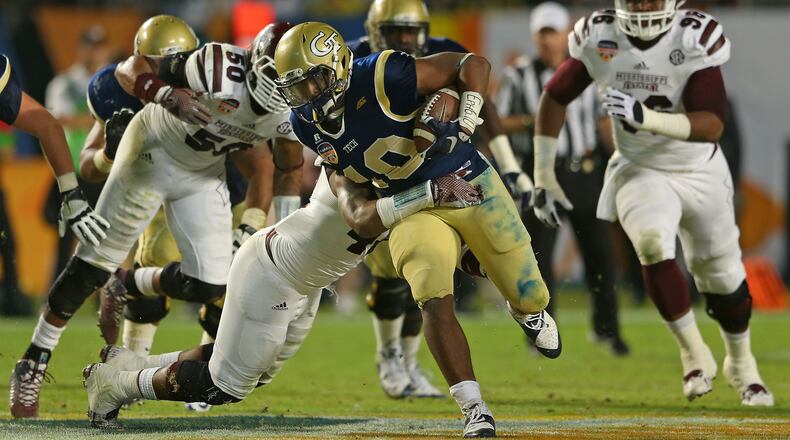 MIAMI GARDENS, FL - DECEMBER 31: Synjyn Days #10 of the Georgia Tech Yellow Jackets carries during the Capital One Orange Bowl game against the Mississippi State Bulldogs at Sun Life Stadium on December 31, 2014 in Miami Gardens, Florida. (Photo by Mike Ehrmann/Getty Images) Former Georgia Tech running back Synjyn Days' powerful running style earned him an invitation into the Medal of Honor Bowl. He is making good use of the opportunity, attracting the attention of NFL scouts. (ASSOCIATED PRESS)