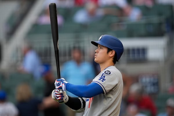 Los Angeles Dodgers two-way player Shohei Ohtani (17) prepares to bat against the Atlanta Braves in the first inning of a baseball game, Friday, May 2, 2025, in Atlanta. (AP Photo/Mike Stewart)