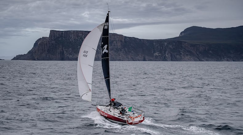 In this photo provided by the Cruising Yacht Club of Australia, the boat Min River is sailed by Jiang Lin and Alexis Loison near Hobart, Australia, Tuesday, Dec. 30, 2025, as they finish the Sydney Hobart yacht race. (Kurt Arrigo/CYCA via AP)