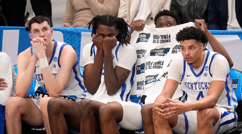 Players on the Kentucky bench watch late in the second half of the team's college basketball game against Oakland in the first round of the men's NCAA Tournament in Pittsburgh, Thursday, March 21, 2024. Oakland won 80-76. (AP Photo/Gene J. Puskar)