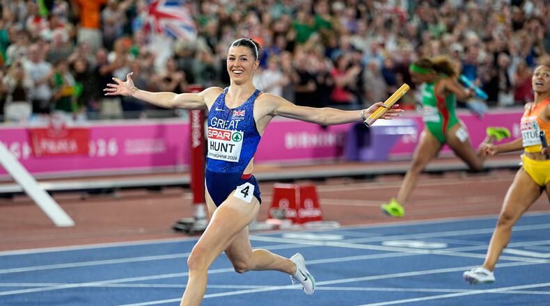 Britain's Amy Hunt crosses the finish line to win the mixed 4 X 100 meters relay final setting a new European record at the European Athletics Championships in Birmingham, England, Sunday, Aug. 16, 2026. (AP Photo/Matthias Schrader)