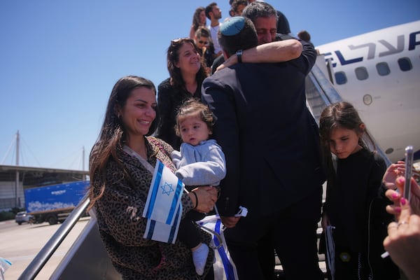 New Jewish immigrants from Spain, England, France and the Netherlands disembark from an airplane a day after the announcement of a ceasefire between Israel and Iran, as they arrive at Ben Gurion International Airport, near Tel Aviv, Wednesday, June 25, 2025. (AP Photo/Ohad Zwigenberg)