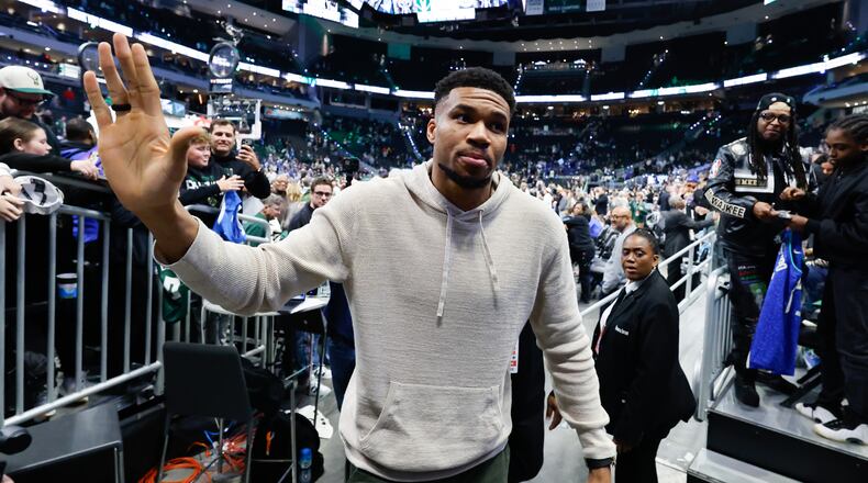 Milwaukee Bucks forward Giannis Antetokounmpo, center, walks off the court after an NBA basketball game against the Brooklyn Nets, Friday, April 10, 2026, in Milwaukee. (AP Photo/Jeffrey Phelps)