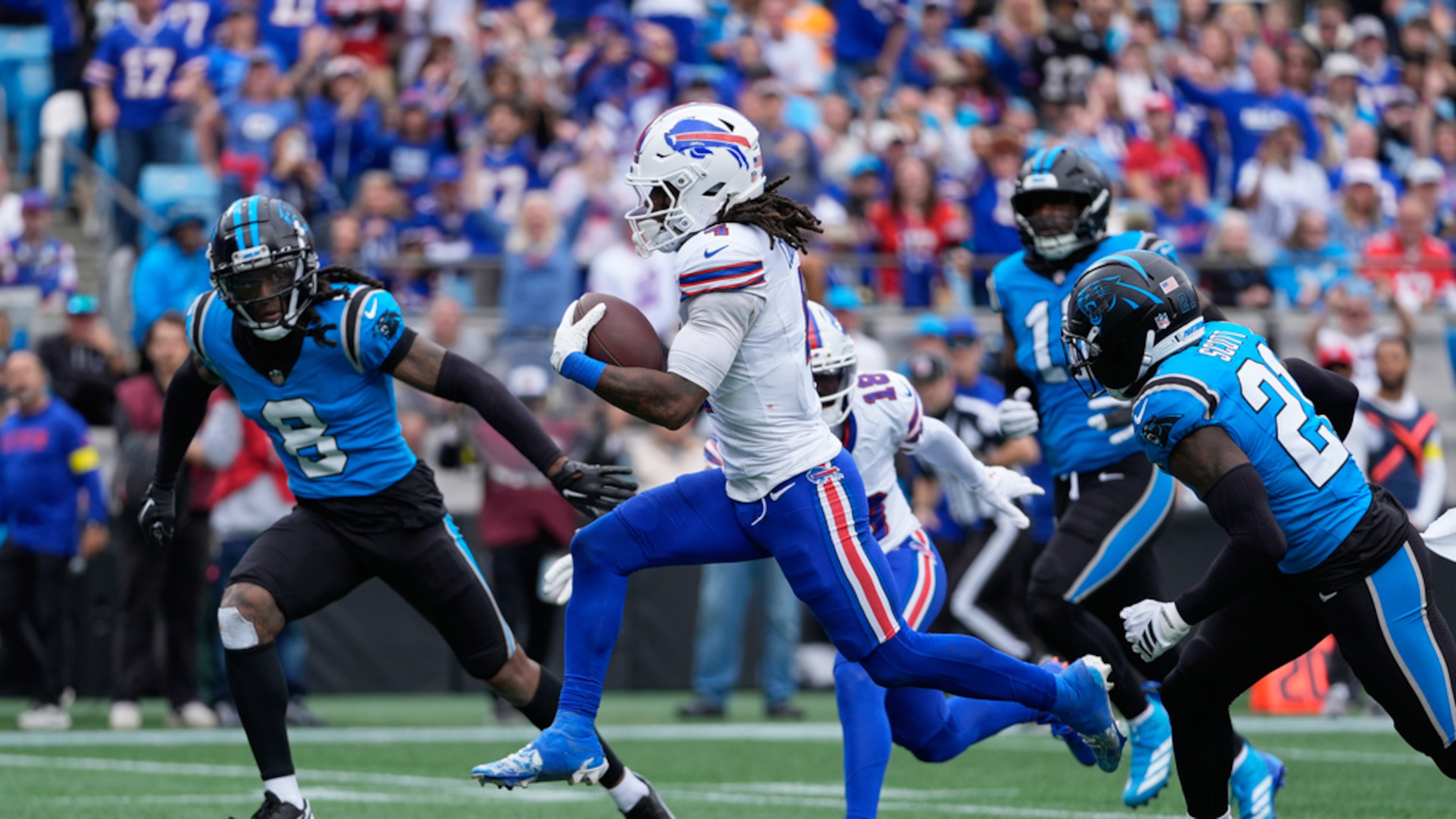 Buffalo Bills running back James Cook III (4) runs for a touchdown against the Carolina Panthers during the second half an NFL football game, Sunday, Oct. 26, 2025, in Charlotte, N.C. (Erik Verduzco/AP)