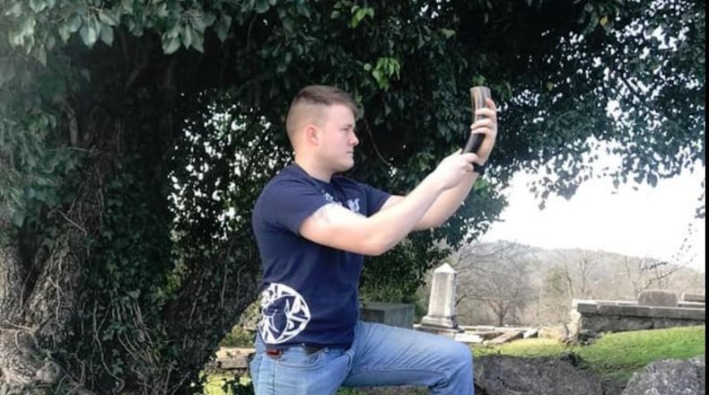 Haralson County jailer Trent East in a photo posted to the Ravensblood Kindred Facebook page. According to the caption, East was taking part in a Norse pagan rite to Wotan, the Germanic name for the Norse god Odin, in the Myrtle Hill Cemetery in Rome, Ga. Haralson County and the Alabama National Guard are investigating East’s alleged ties to white supremacist organizations.
