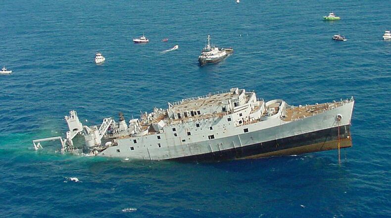 The 46-year-old Spiegel Grove begins to sink off Key Largo, Fla., on May 17, 2002, after accidentally taking on more water while crews were preparing to scuttle her to create the world’s largest artificial reef. A Lawrenceville man died Monday while diving in the area. (AP file photo)