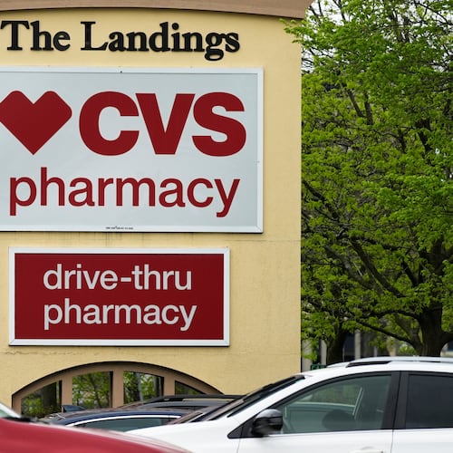 FILE - CVS pharmacy and drive-thru signs are seen outside of CVS store in Park Ridge, Ill., Monday, April 29, 2024. (AP Photo/Nam Y. Huh, file)