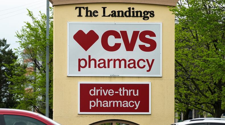 FILE - CVS pharmacy and drive-thru signs are seen outside of CVS store in Park Ridge, Ill., Monday, April 29, 2024. (AP Photo/Nam Y. Huh, file)