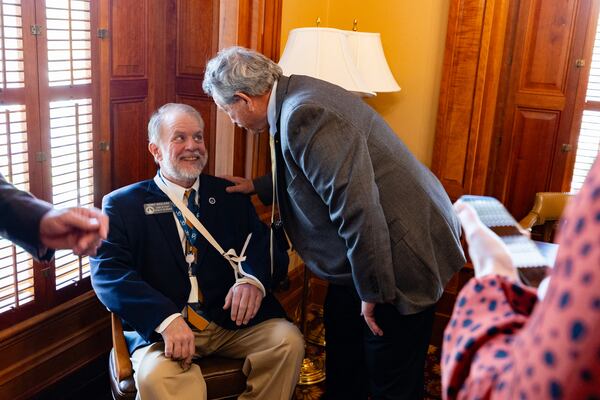 Georgia State Rep. Alan Powell, R-Hartwell, greets Terry England (left), the chief of staff to the Georgia House Speaker, at the Capitol in Atlanta on Thursday.