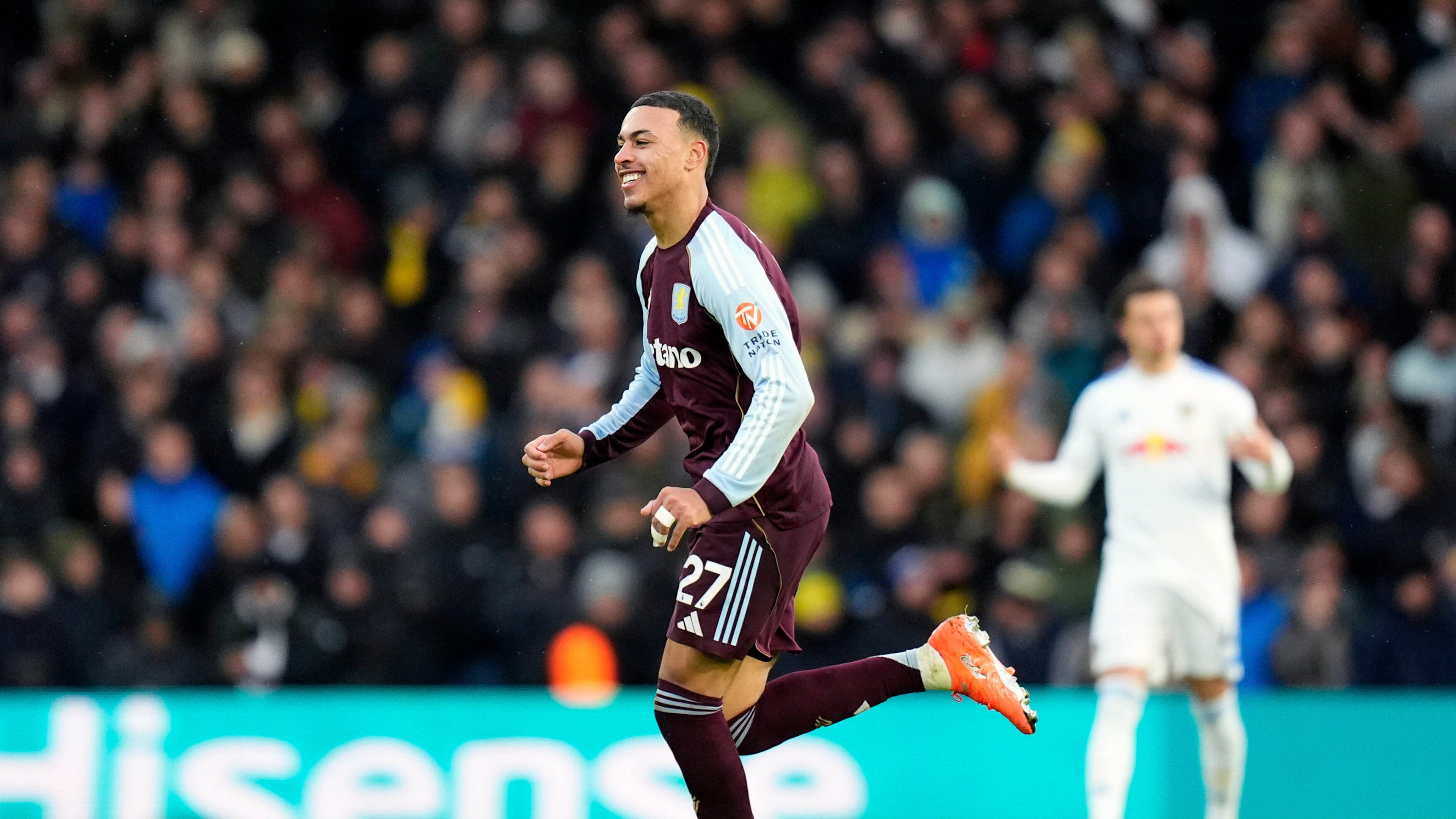 Aston Villa's Morgan Rogers celebrates scoring their side's first goal of the game during the Premier League match between Leeds and Aston Villa in Leeds, England, Sunday, Nov. 23, 2025. (Danny Lawson/PA via AP)