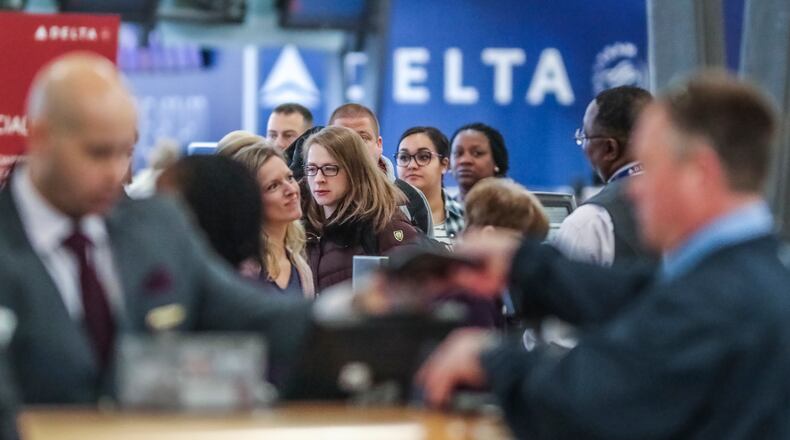 Delta Air Lines said it is waiving change fees for all domestic travel through April 30 and for international travel through May 31, 2020. (AJC file photo)