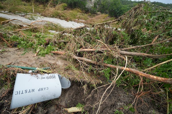 A toppled Camp Mystic mailbox near the entrance to the establishment along the banks of the Guadalupe River after a flash flood swept through the area on Saturday in Hunt, Texas.
