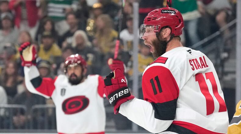 Carolina Hurricanes center Jordan Staal, right, celebrates his goal during the first period in Game 4 of the NHL hockey Stanley Cup Final series against the Vegas Golden Knights, Tuesday, June 9, 2026, in Las Vegas. (AP Photo/John Locher)