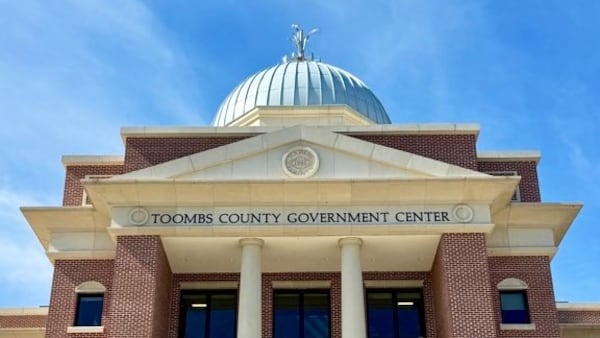 The metalwork onion that adorns the top of the Toombs County Government Center in Lyons is a symbol of the renowned Vidalia onions that grow in the region. (Joe Kovac Jr./AJC)