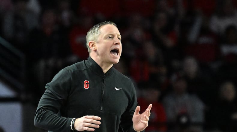 Georgia coach Mike White gives instructions to his players during the first half against Arkansas at Stegeman Coliseum on Saturday, Jan. 17, 2026, in Athens. (Hyosub Shin/AJC)