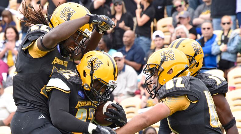 Kennesaw State running back Jae Brown (32) celebrates his touchdown against Point during the first half of an NCAA college football game, Saturday, Oct. 10, 2015, in Kennesaw, Ga. (AP Photo/Lisa Marie Pane)