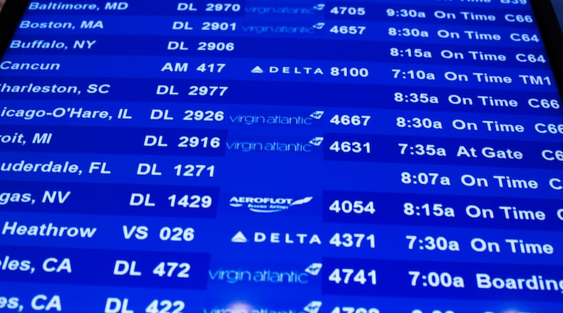 A flight information board is displayed at John F. Kennedy International Airport in New York. REUTERS/Lucas Jackson