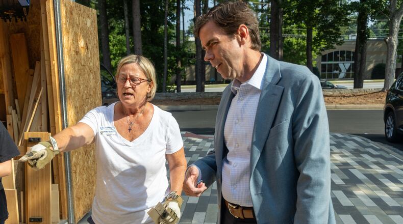 Colin Creel (right), headmaster of Cornerstone Christian Academy in Peachtree Corners talks with woodworking teacher Jennifer Julius. PHIL SKINNER FOR THE ATLANTA JOURNAL-CONSTITUTION